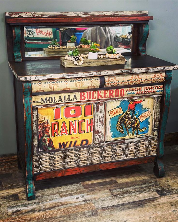 an old wooden cabinet painted with advertisements