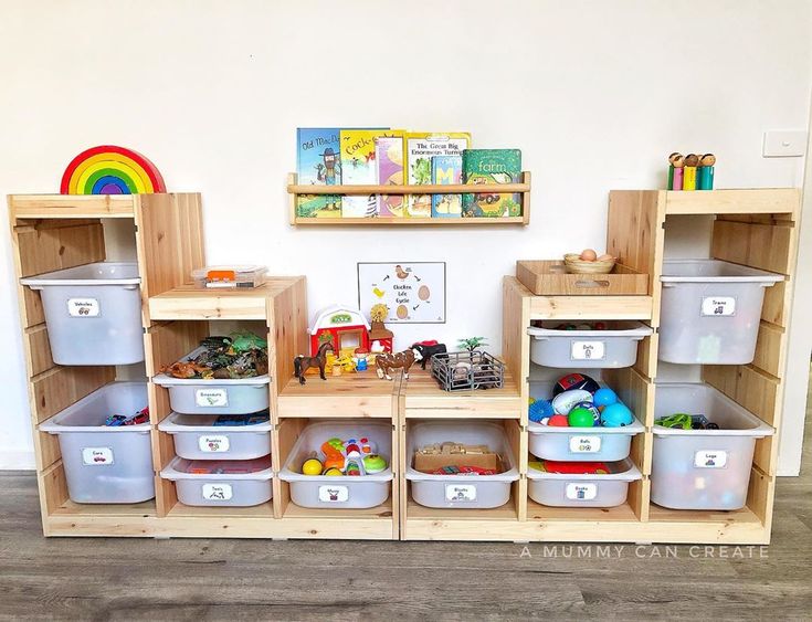 a child's play room with wooden shelves and bins