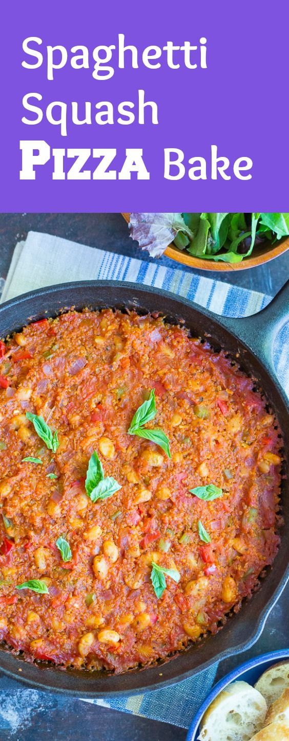 spaghetti squash pizza bake in a cast iron skillet with basil leaves on top