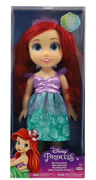 the little mermaid doll has red hair and is wearing a green dress with purple bows