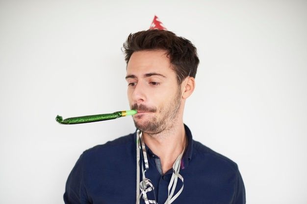 a man with a green toothbrush in his mouth