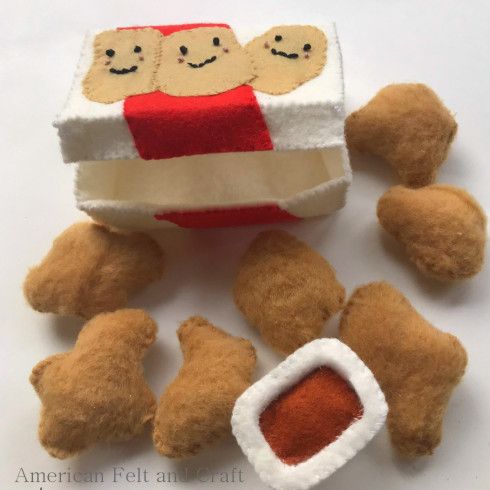 there is a small stuffed toy with food on it