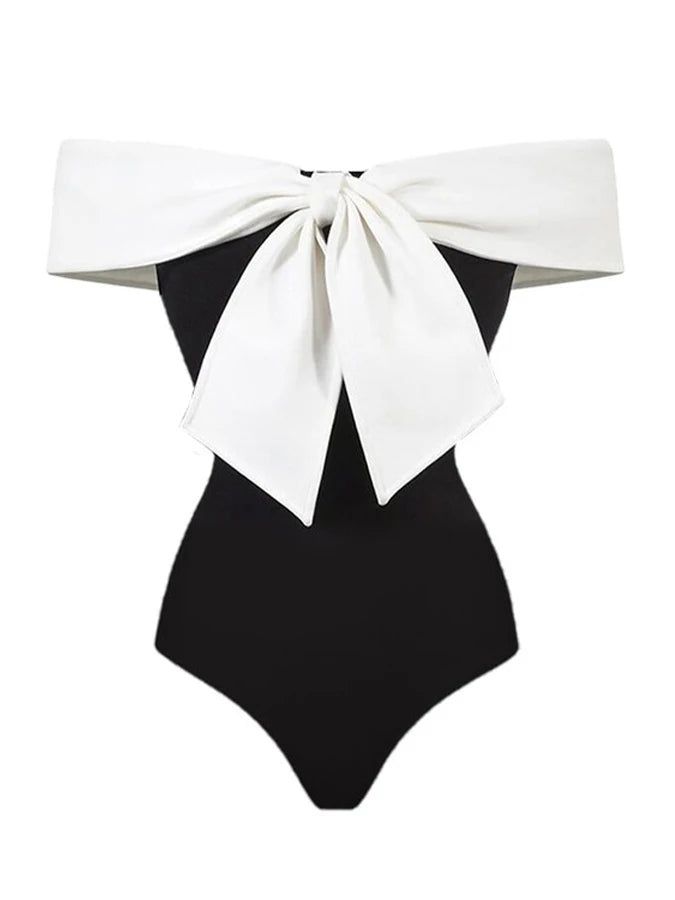 Spice up your swimwear collection with this retro one-piece! The black and white design adds a touch of classic charm, while the big white ribbon at the front adds a fun and flirty twist. Perfect for pool parties or beach days, you'll make a statement in the Black White Retro One Piece. SIZE CHART Measurements are in inches Size Chest Waist Hips S 32-34 25-27 35-37 M 34-36 27-29 37-39 L 36-38 29-31 39-41 XL 38-40 32-35 42-45 Please take note of the size measurement when ordering your size. Black And White Pool Party, White Pool Party, Retro One Piece, Athleisure Dress, Swimwear Sets, Swimwear Bottoms, Sleepwear Sets, White Ribbon, Romper Dress