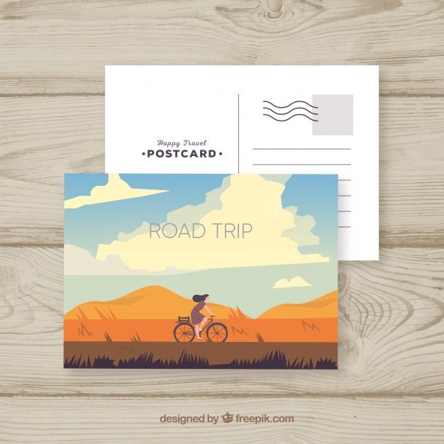 a postcard with an image of a man riding a bike on the road trip