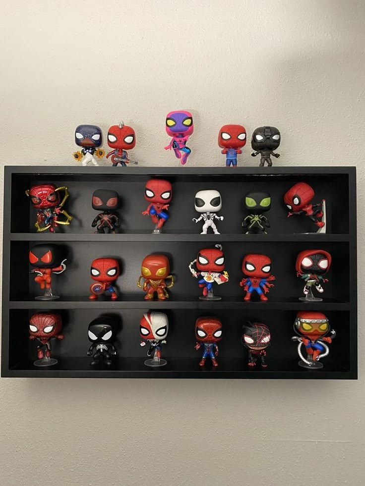 a shelf filled with different kinds of action figures