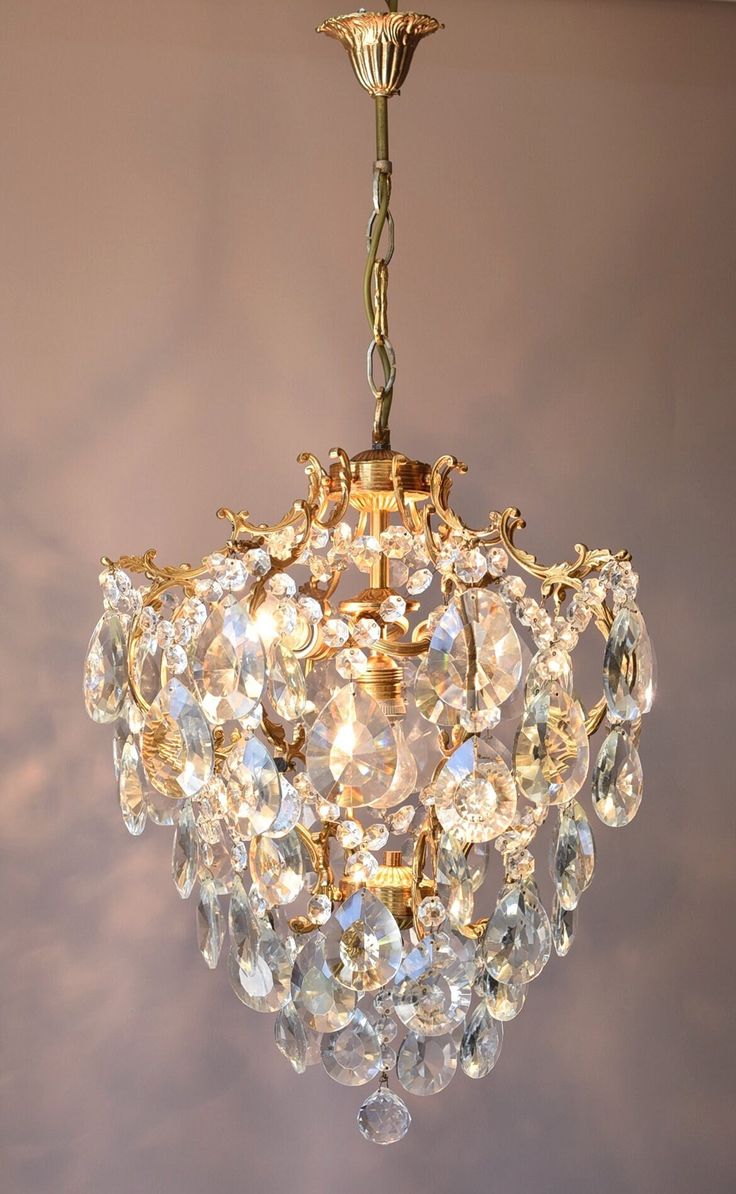 a chandelier hanging from the ceiling in a room