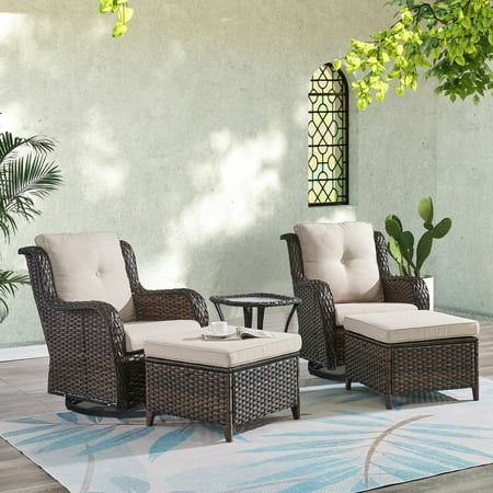 an outdoor patio with wicker furniture and potted plants