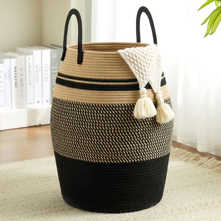 a black and white basket on the floor