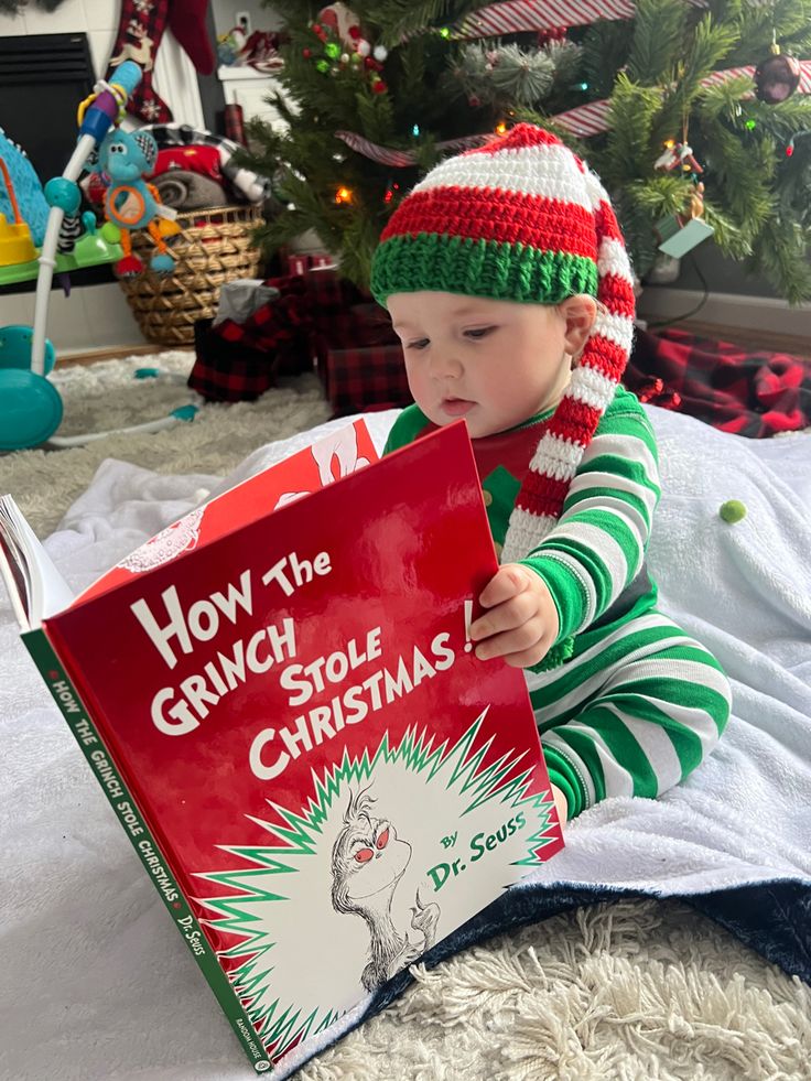 a small child is reading a book about how the grin stole christmas