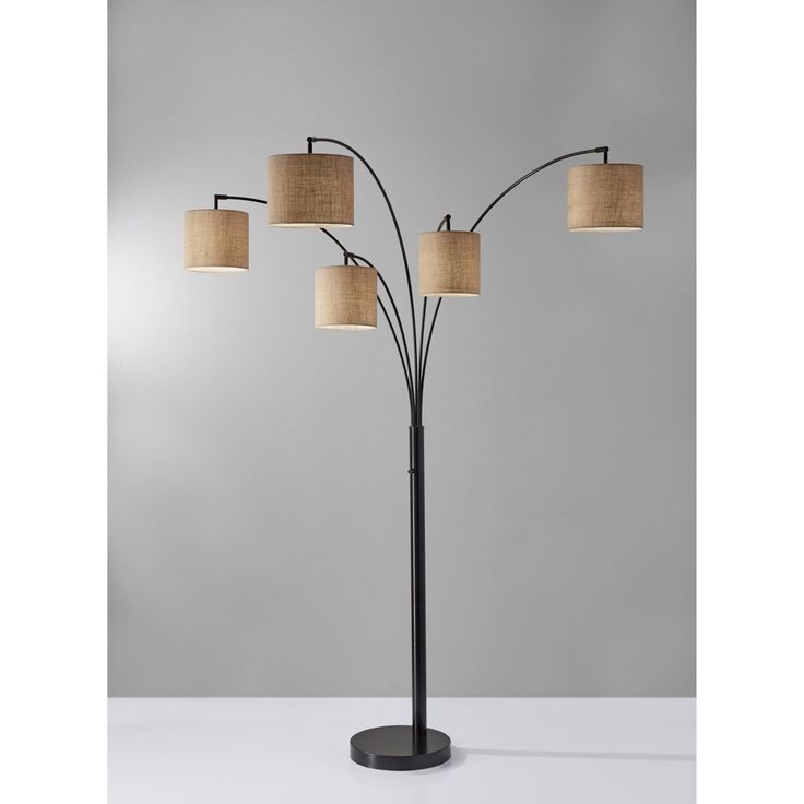 a floor lamp with four lamps on it and three shades of light in the shade