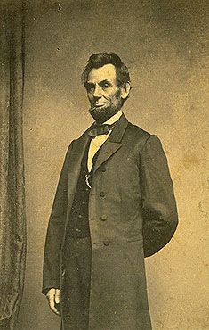 an old black and white photo of a man in a suit