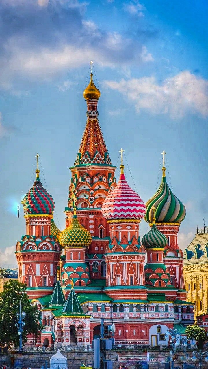 an ornate building with many colorful domes on it