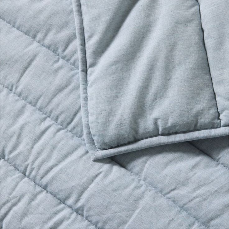 a close up view of a blue quilt