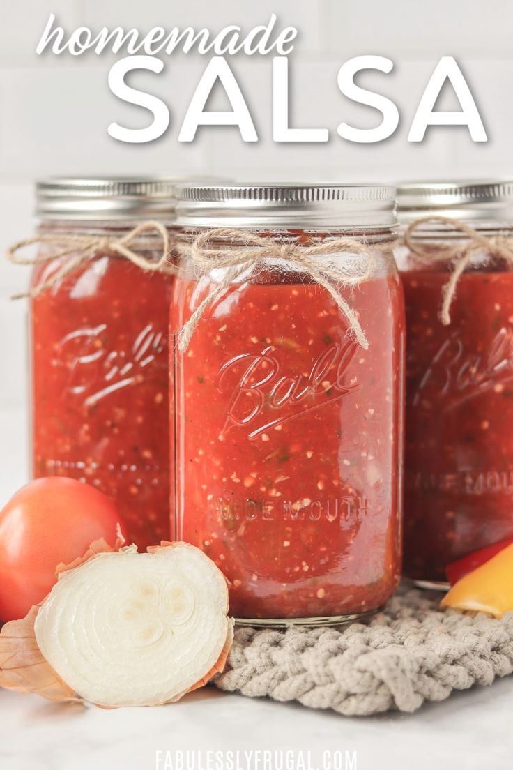 three jars filled with homemade salsa sitting on top of a table next to an onion slice