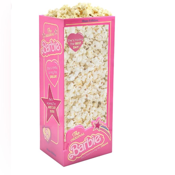 a pink box filled with popcorn on top of a white background