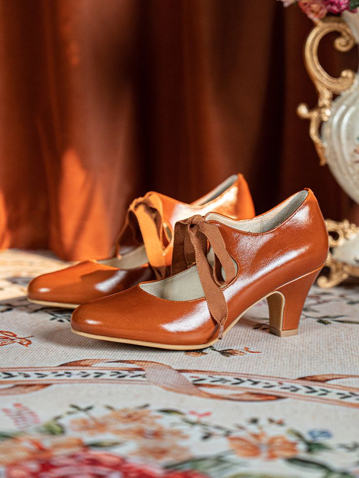 Step back in time with these 1920s-style vintage-inspired Mary Jane heels. Featuring an elegant oil-waxed genuine leather upper, these shoes are a perfect blend of vintage charm and modern comfort. The classic ribbon tie adds a touch of sophistication, while the 6.5 cm (approximately 2.5 inches) rubber sole provides a stable lift. These versatile shoes are ideal for anyone looking to capture a timeless look with a nod to the past. The leather insole ensures lasting comfort, while the pigskin lining keeps your feet feeling fresh all day. Whether you pair them with a vintage dress or modern attire, these Victorian-inspired heels are perfect for both casual and formal occasions. Key Features: Genuine oil-waxed leather upper for a luxurious feel Rubber sole for stability and traction 6.5 cm (2 Vintage Low Heel Leather Shoes For Fall, Vintage Leather Low Heel Shoes For Fall, Vintage Leather Shoes With Low Heel For Fall, Retro Leather Shoes With Leather Sole For Fall, Retro High Heels With Penny Strap, Retro High Heel Penny Strap Heels, Retro Penny Strap High Heels, Vintage High Heel With Penny Strap, Vintage Brown Heels With Wooden Heel