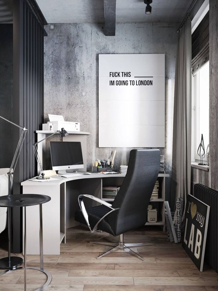 an office with a desk, chair and computer