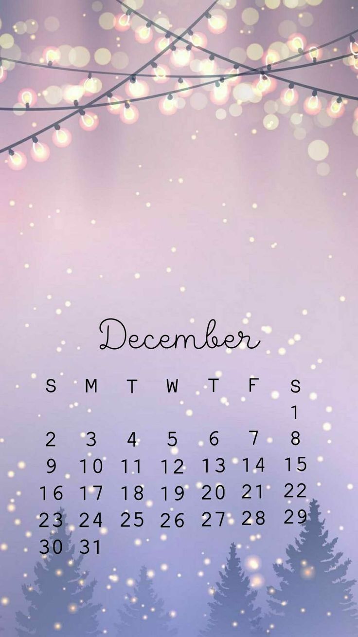 a desktop calendar with trees and lights in the background, for december 2012 or december 2013