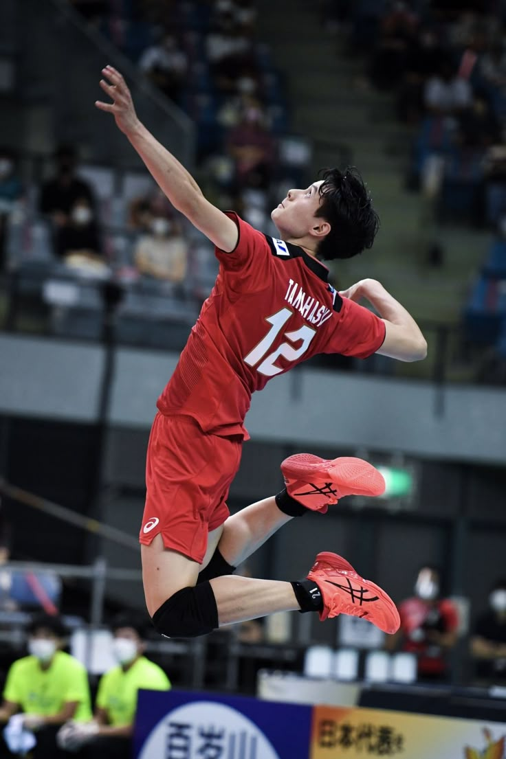 a man jumping up in the air to catch a frisbee