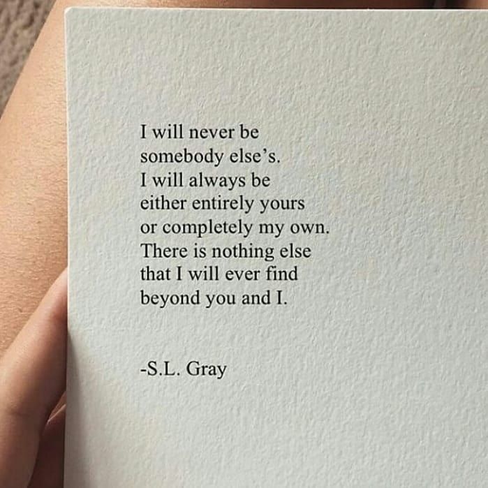 someone holding up a piece of paper with a quote on it that says i will never be somebody else's, i will always be either entirely yours or completely yours