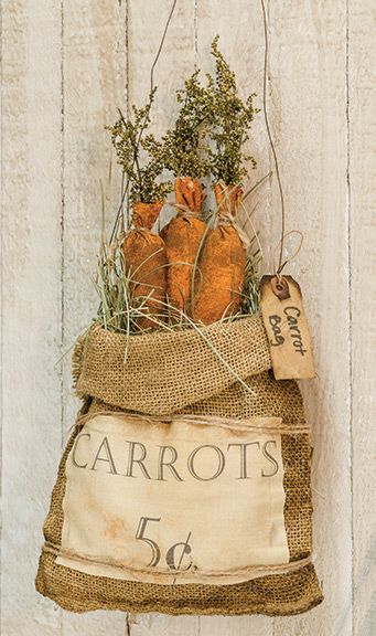 an old sack with carrots hanging from it