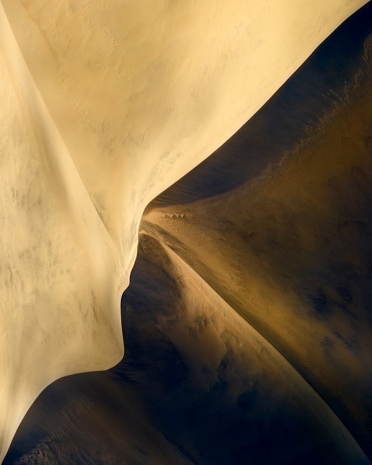 an aerial view of the sand dunes and sky