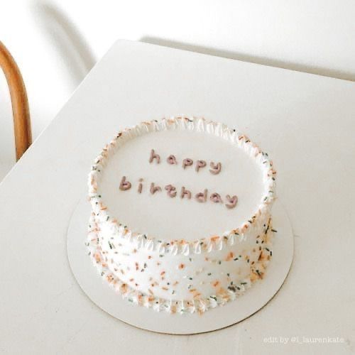 a birthday cake sitting on top of a white table