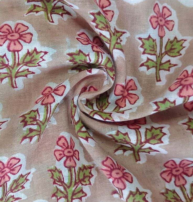 the fabric has pink flowers on it