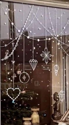 a window decorated with ornaments and lights