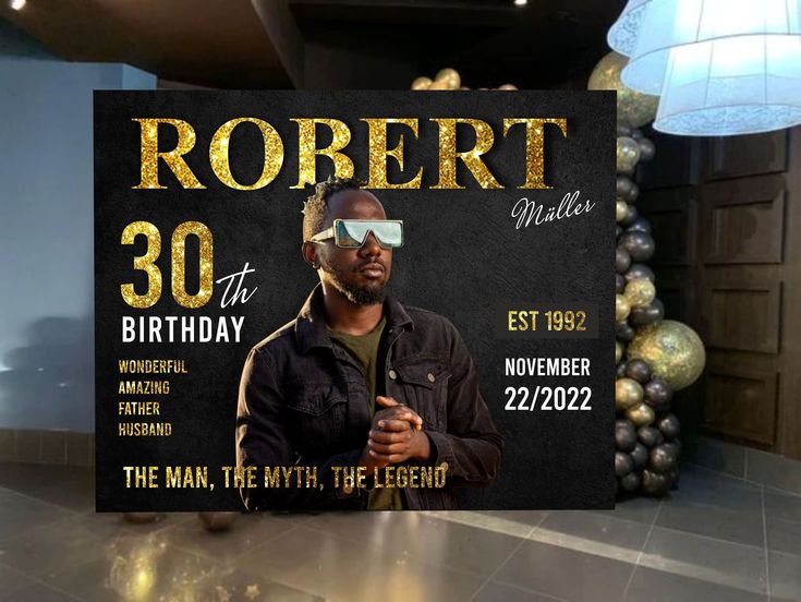 a man wearing sunglasses is standing in front of a sign that says robert 30th birthday