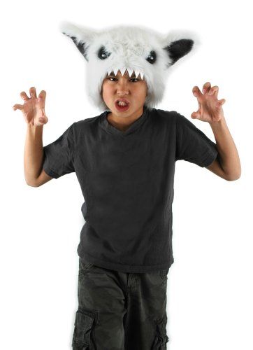 a young boy wearing an animal mask on top of his head with hands in the air