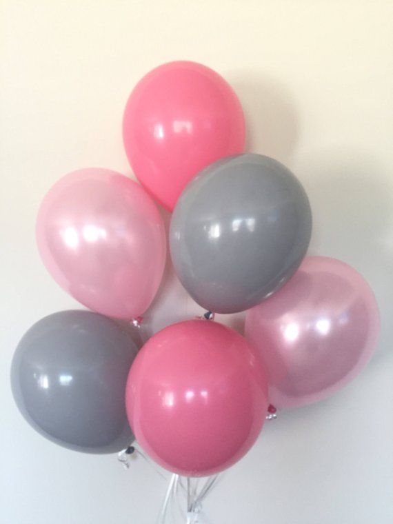 a bunch of balloons that are in the shape of a ballon on a stick