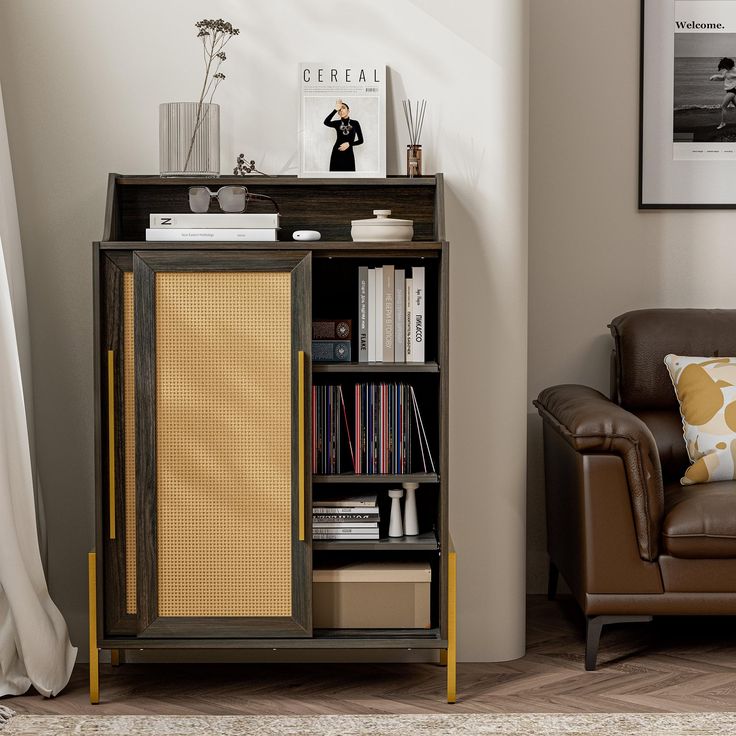 a brown chair sitting next to a book shelf