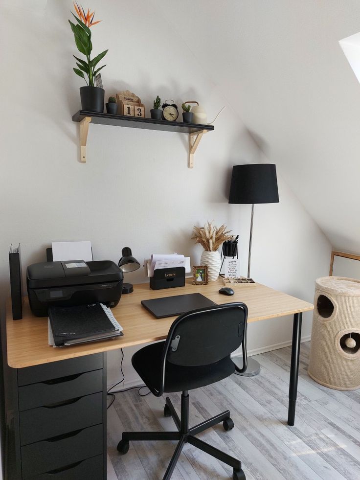 an office with a desk, chair and printer