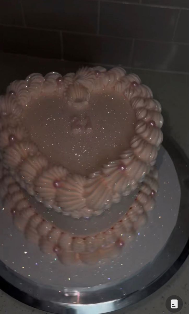 a heart shaped cake sitting on top of a white plate