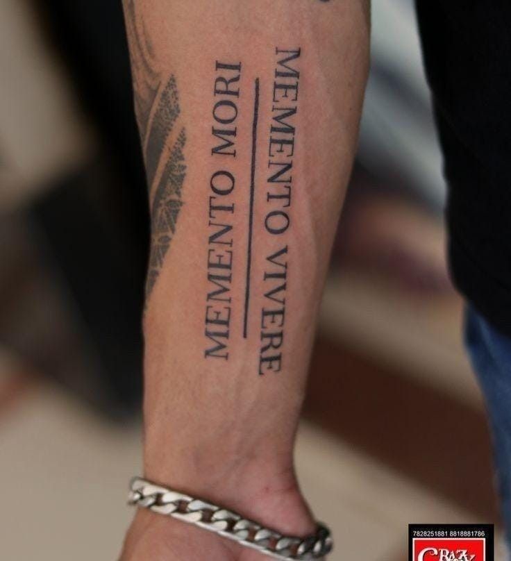 a man with a tattoo on his arm that says men don't know what they are