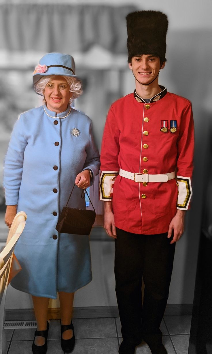 an older man and woman dressed in uniforms