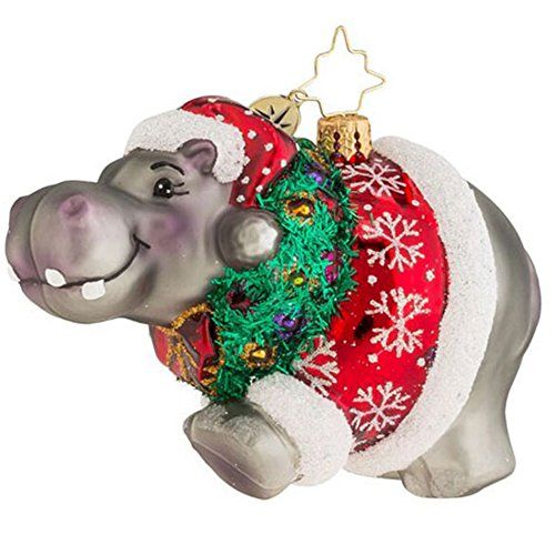 an ornament shaped like a hippo wearing a christmas sweater