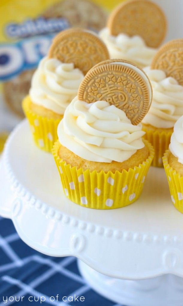 cupcakes decorated with oreo cookies and white frosting