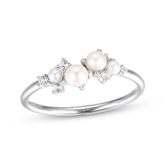 This lovely ring will add a delightful dash of polished shimmer to any look. Four round lustrous freshwater cultured pearls are artfully arranged at the chic center. Sparkling round white lab-created sapphires are perfectly placed, adding extra shimmer and shine to the sterling silver silhouette. Gold Layered Bracelets, Pearl Diamond Jewelry, Cross Jewelry Necklace, Fan Jewelry, Pearl Engagement Ring, White Lab, Shimmer And Shine, Silver Wedding Rings, Christmas 2022