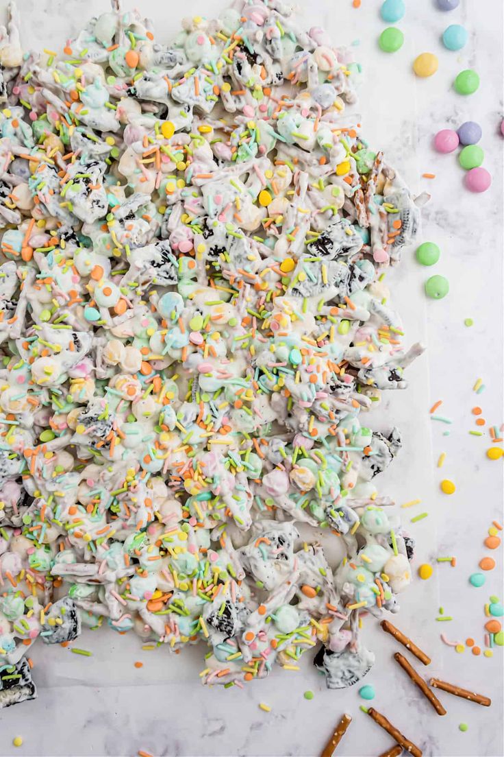 a pile of candy with sprinkles and candies