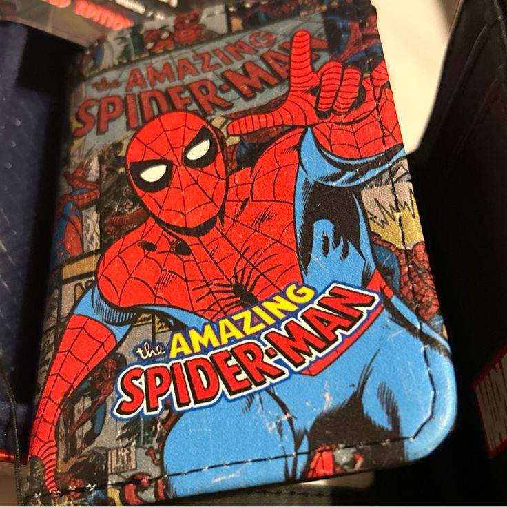 a spiderman book sitting on top of a table