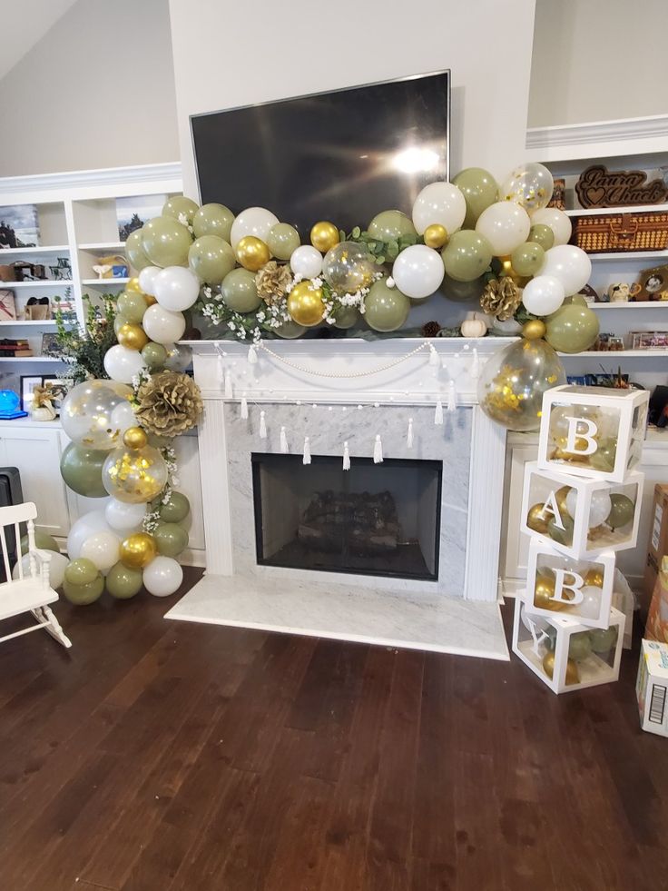 a fireplace decorated with balloons and garlands