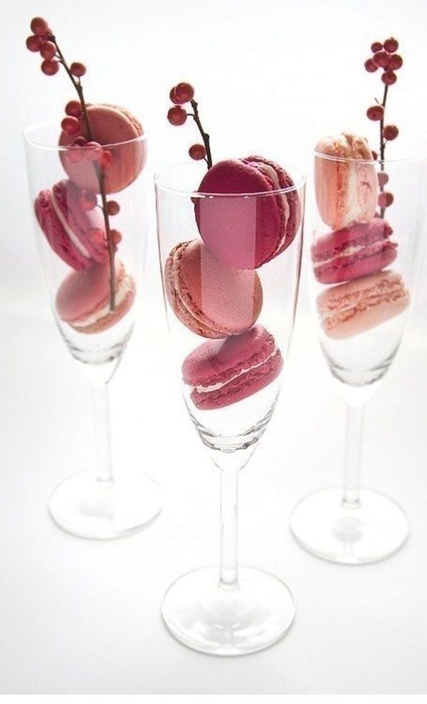 three wine glasses filled with different types of desserts