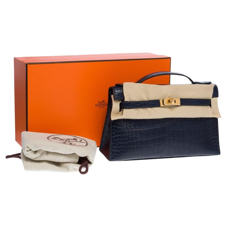 Rare & Exceptional Pochette Hermès Kelly Clutch in Blue Indigo matte Porosus Crocodile leather, gold-plated metal hardware, Blue crocodile handle for a hand carry Flap closure Inner lining in blue leather, one patch pocket Signature: "Hermès Paris Made in France " Stamp: B (2023) Dimensions: 22x12x7 cm (8,7x4,7x2,7 Inches) Reference: 101375 General condition: 9.5/10 Sold with copy of the Hermès invoice , Cites, felt, dustbag and box In Mint condition Option in addition: Certificate of authentici France Stamp, Hermes Clutch, Hermes Paris, Crocodile Leather, Hermes Bags, Metal Hardware, Clutch Handbag, Birkin Bag, Gucci Jackie Bag