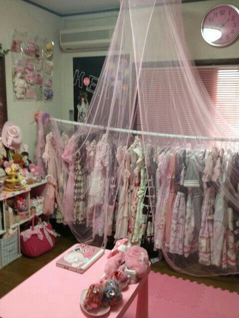 a room filled with lots of baby clothes