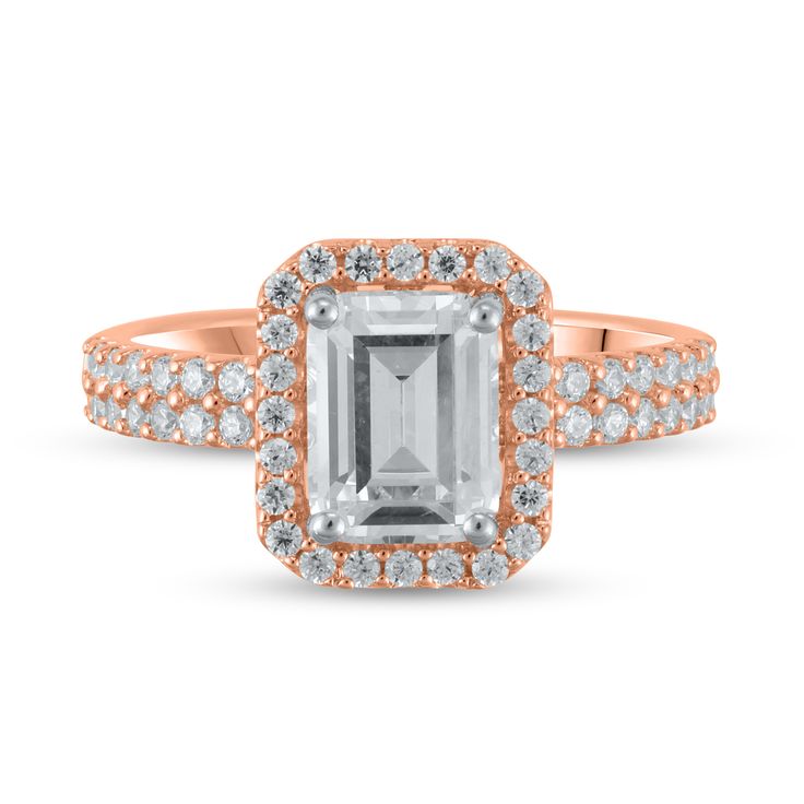 an emerald and diamond ring with two rows of diamonds on the band, set in 18k rose gold