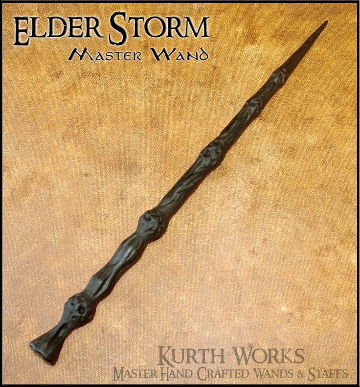 the elder storm master wand is on display in front of a brown background with black writing