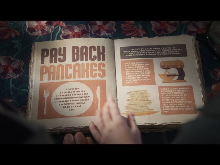 an open book with instructions on how to bake pancakes and what to use them