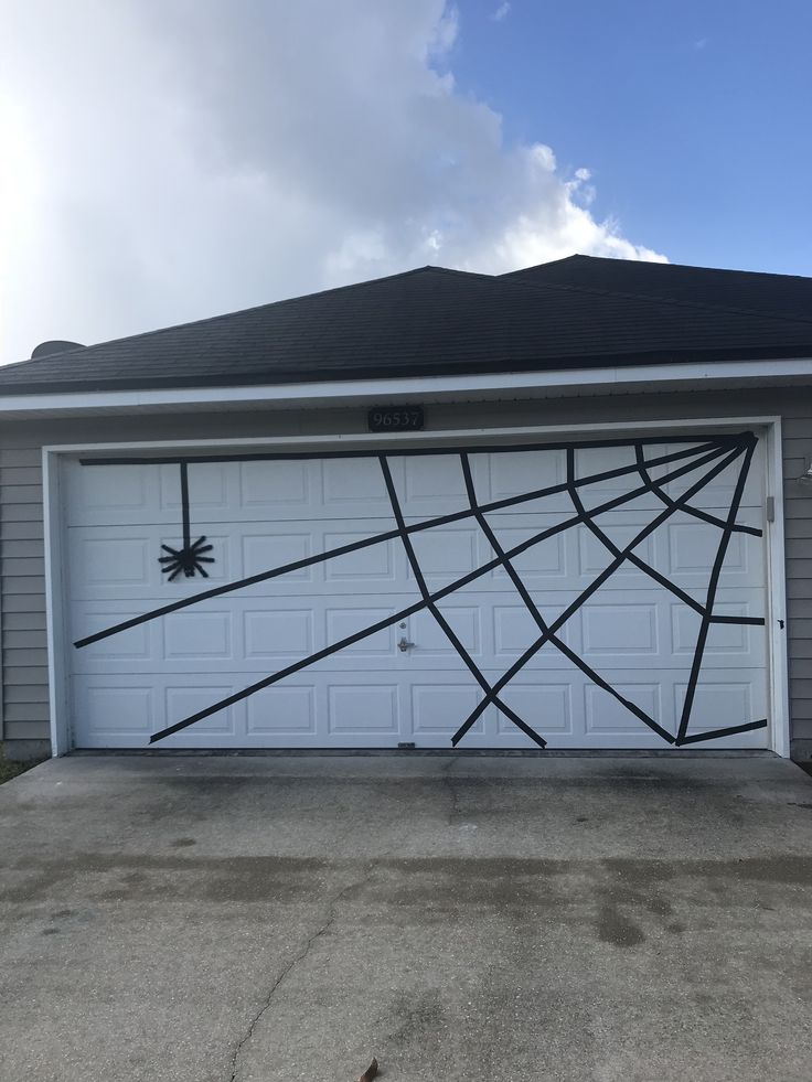 a garage with a spider web design painted on it